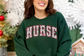 Christmas Pink Varsity Nurse Sweatshirt